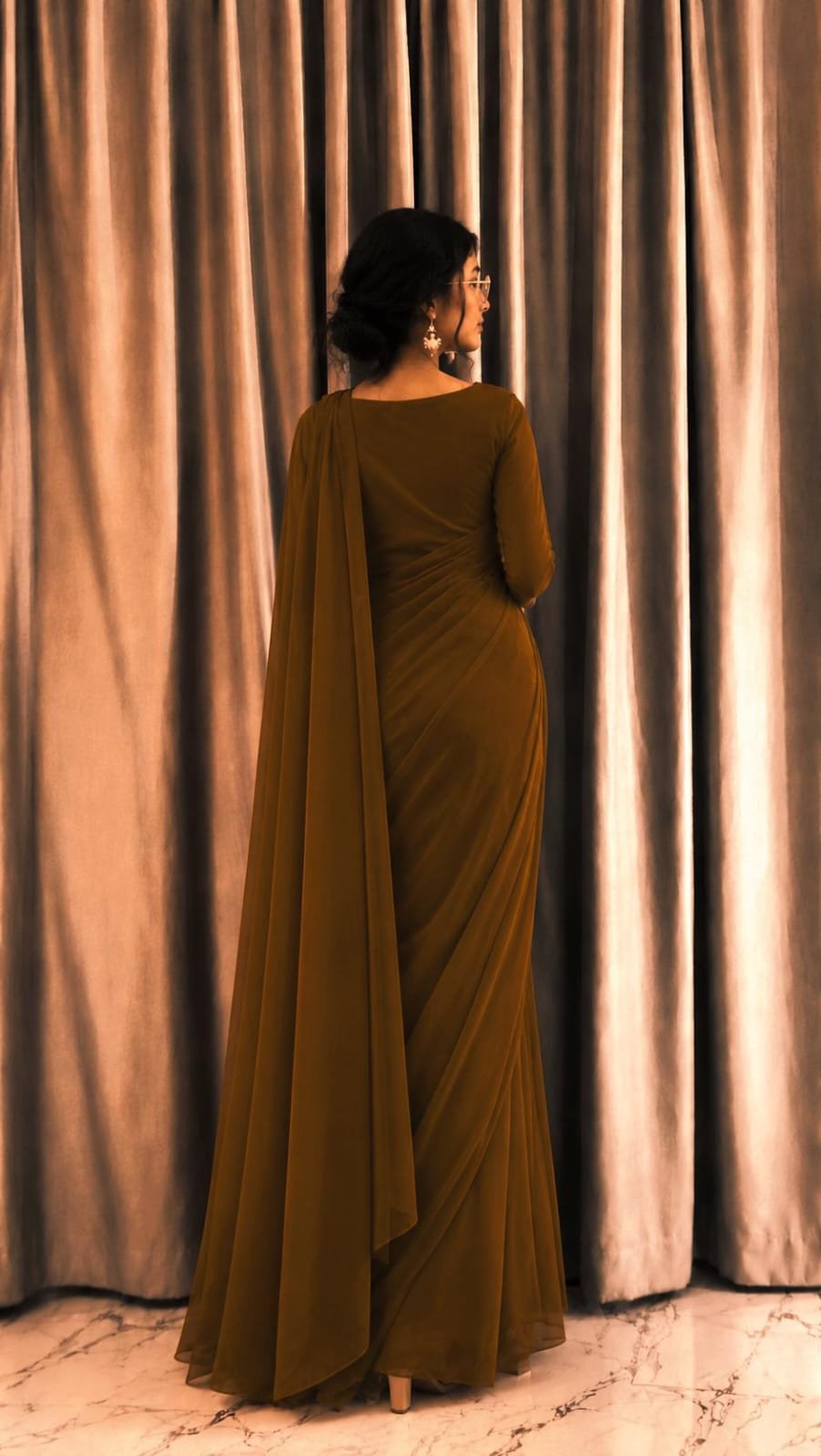 A candid moment of Laiba in her brown outfit